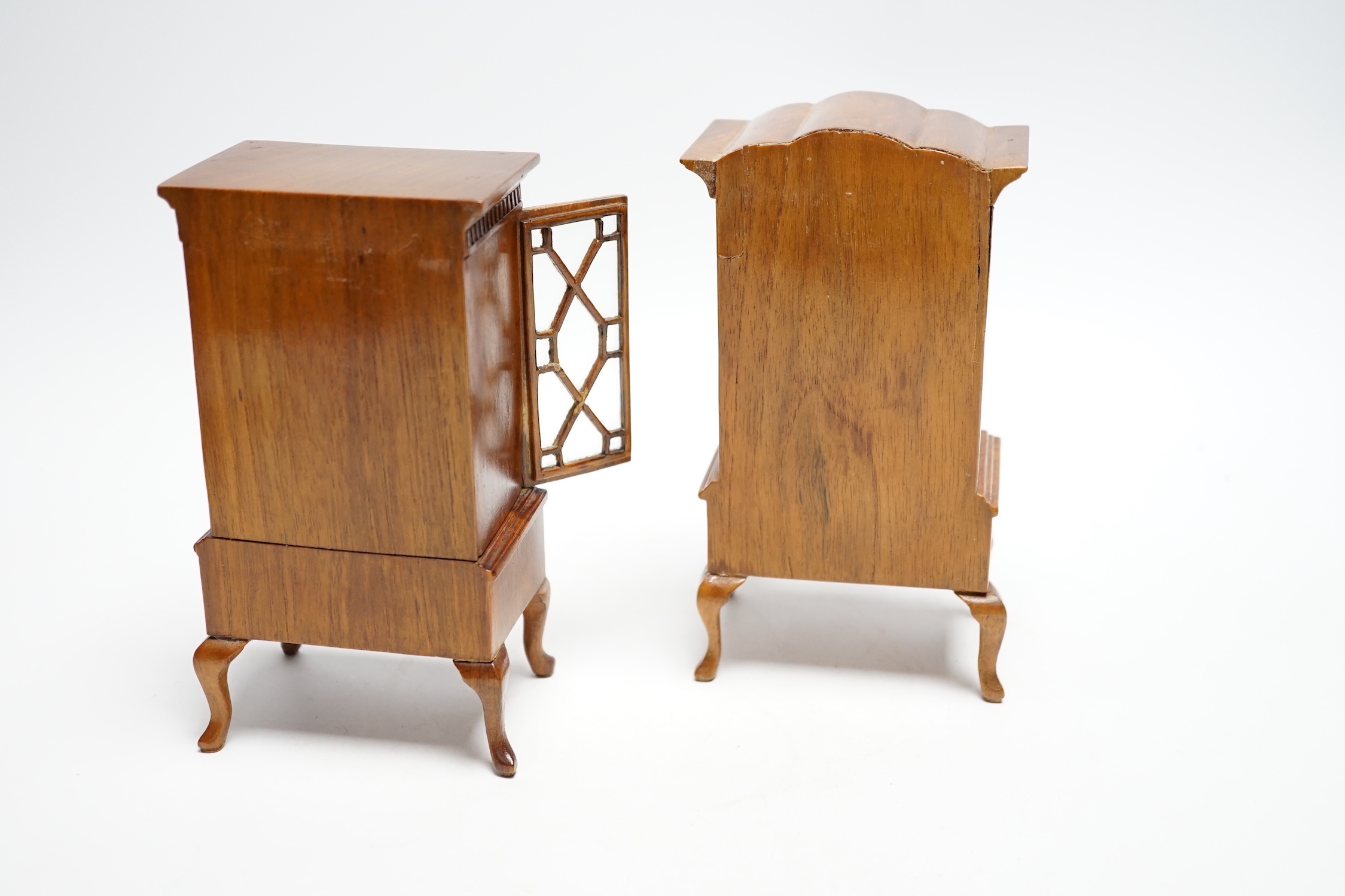 Two pieces of early 20th century miniature furniture - a mid-18th century style walnut bookcase, indistinctly signed on the base (15.5cm high) and a mid-18th century-style walnut chest on stand (16cm high). (Provenance B